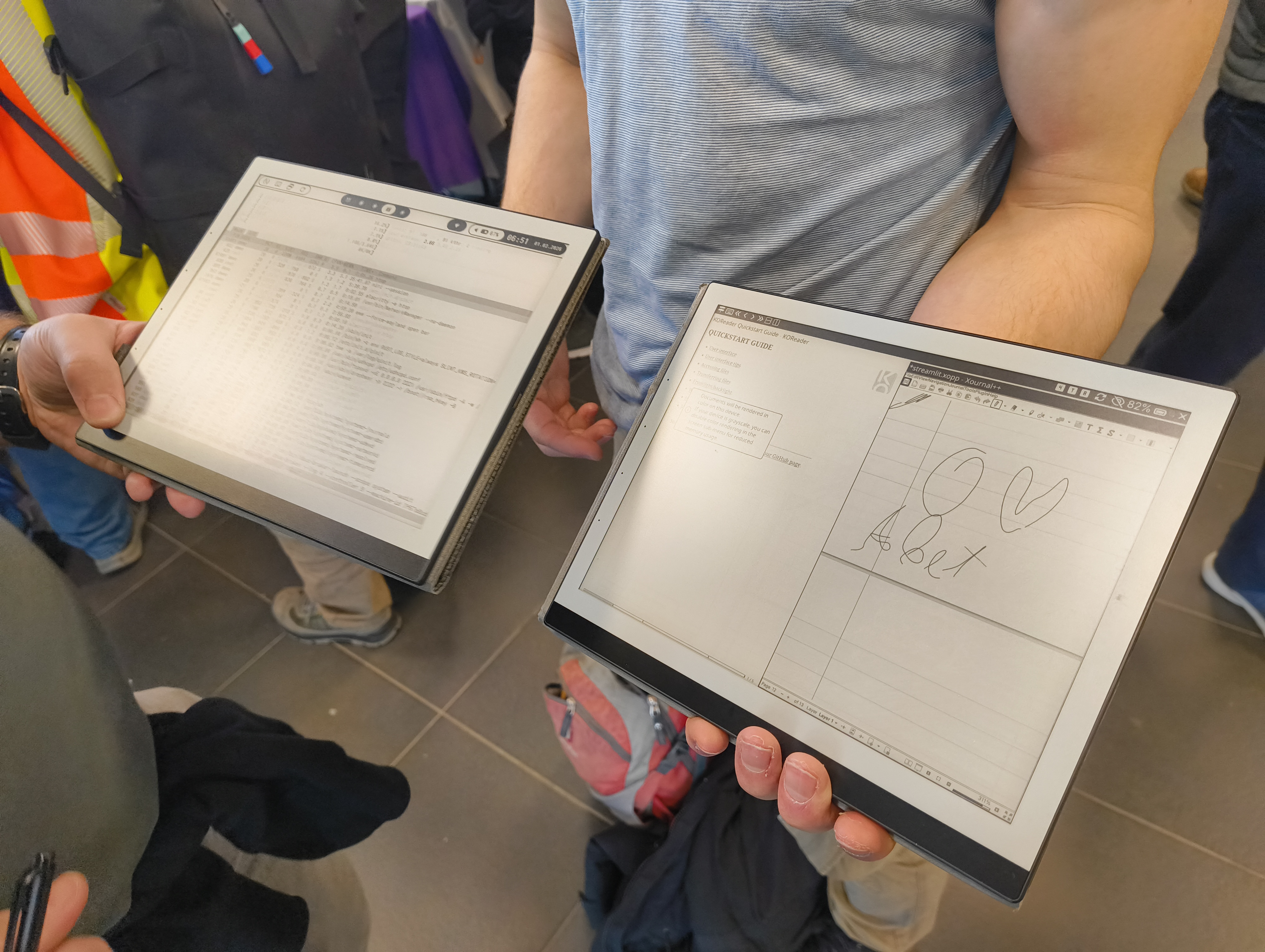 Photo of two PineNotes, one running Arch and one running QuillOS