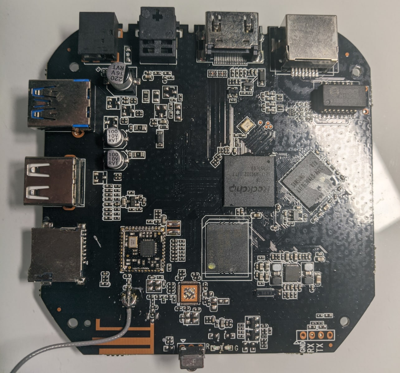 Internals of the RockBox with the UART contacts visible on the bottom right