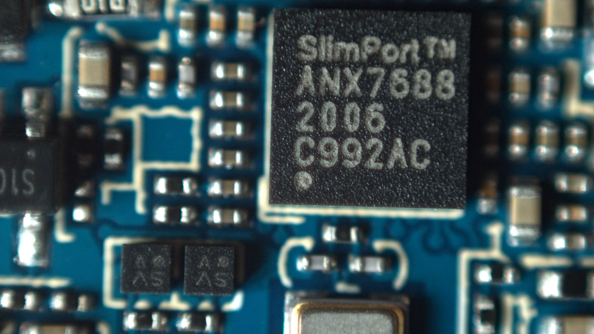 Close-up picture of the two identical switches the issue originates from, with the ANX USB controller in the frame