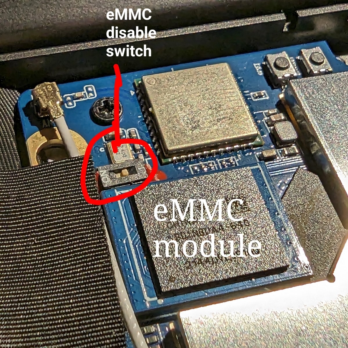 The PineBook Pro eMMC module and switch, shown in &rsquo;enabled&rsquo; position