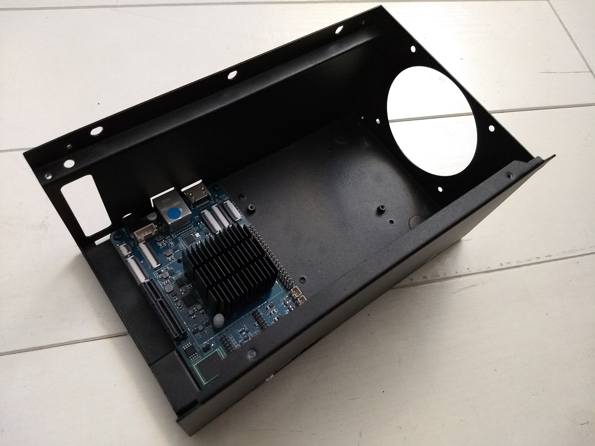 Correct Placement of the ROCKPro64 in the empty case, with Ethernet; Power; and HDMI at the back of the NAS Case